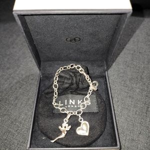 Links of London bracelet with 2 charms